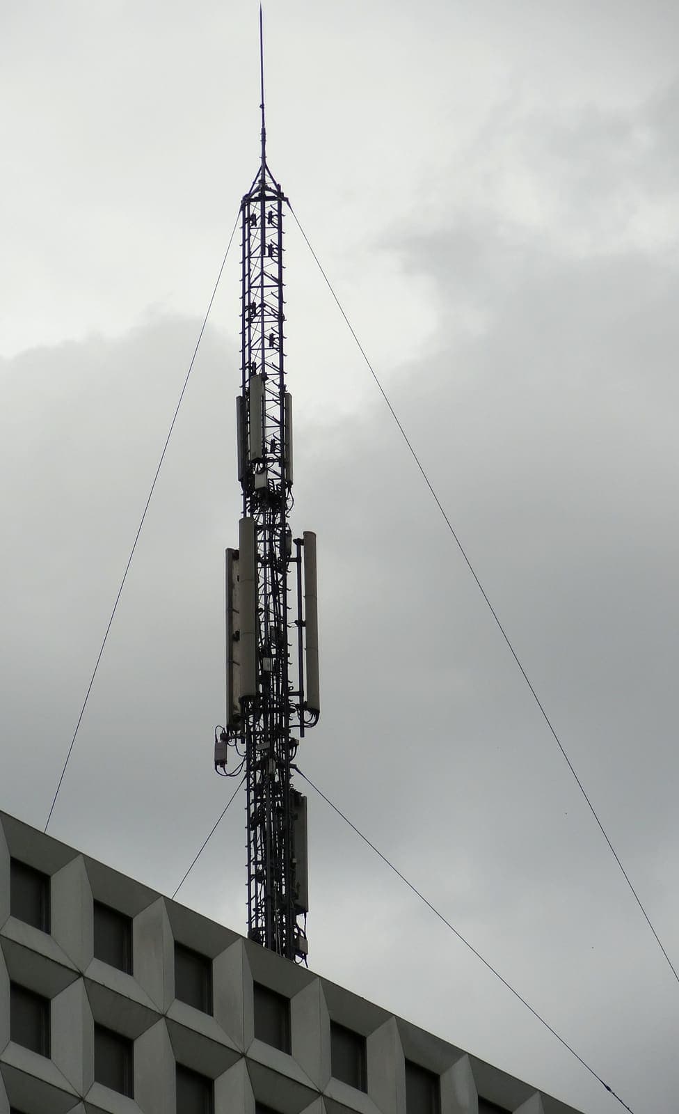 Telecommunications relay tower with mounted antennas